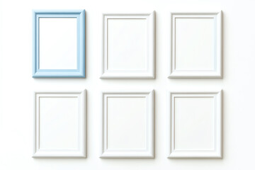 Empty picture frames arranged on a white background for creative display.
