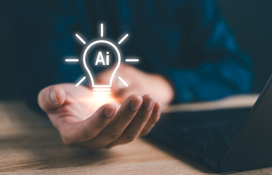 Concept of new ideas generate by AI (artificial intelligence) technology. Man hand holding light bulbs with AI symbol. New ideas with innovative bulb creative, Knowledge in education - Powered by Adobe