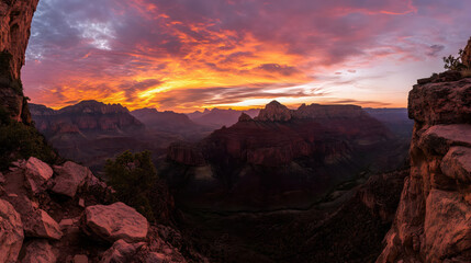 Fototapeta premium A stunning sunset paints the sky in vibrant hues of orange, pink, and purple above the dramatic landscape