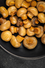 Champignon mushroom canned product tasty food dish fresh delicious gourmet food background on the table rustic food top view copy space top view keto and paleo diet Vegetarian and vegan food