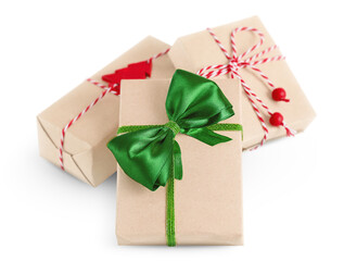 three Christmas gift boxes are packed in eco-friendly materials. Isolated on a white background