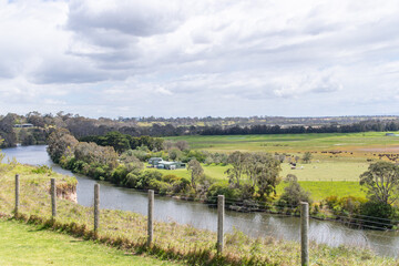 Obraz premium Panoramic View of Serene River and Rural Landscape, Eagle Point Gippsland Lakes Reserve, Australia