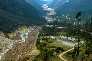 Lachung river flowing through Yumthang Valley or Sikkim Valley of Flowers sanctuary, Himalayan mountains at North Sikkim, India. Also called Valley of Flowers, home to Shingba Rhododendron Sanctuary,