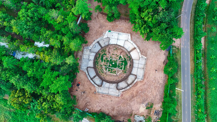 A Thai temple in Prakhon Chai district is surrounded by a verdant garden.