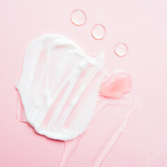 Cosmetic samples texture. Smears of transparent liquid cosmetics on a pink background