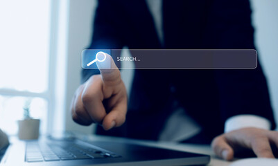 Hands clicking internet search page on touch screen. Searching information on internet. SEO...