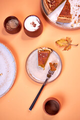 pumpkin pie, pumpkin pie slices on a peach background top view