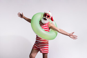 Photo of santa in red striped swimwear open hand summer season sea vacation isolated on white sandy...