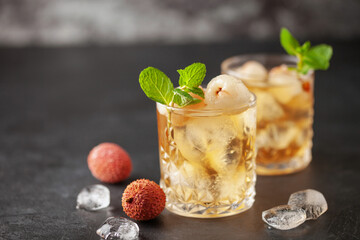 Lychee iced tea with mint leaves in drinking glass. Refreshment drink