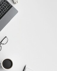 Flat Lay of Modern Office Desk &ndash; A tidy, minimalist workspace with a laptop, coffee cup, and stationary neatly arranged on a white desk, with ample empty space on one side for text or graphics