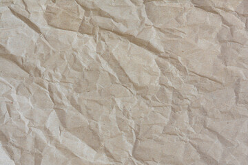 Abstract texture of crumpled and wrinkled brown wrapping paper. 
