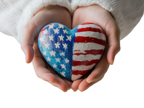Heart-shaped object painted with the American flag held in hands.   PNG transparent.