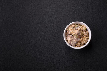 Bowl of food with beef, bulgur, tomatoes, zucchini and sauce