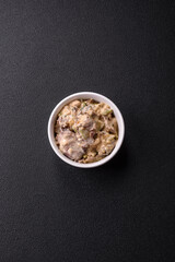 Bowl of food with beef, bulgur, tomatoes, zucchini and sauce