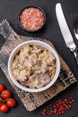 Bowl of food with beef, bulgur, tomatoes, zucchini and sauce