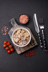 Bowl of food with beef, bulgur, tomatoes, zucchini and sauce