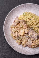 Bowl of food with beef, bulgur, tomatoes, zucchini and sauce