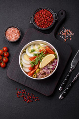 Salad with tuna pieces, boiled egg, cherry tomatoes, lettuce