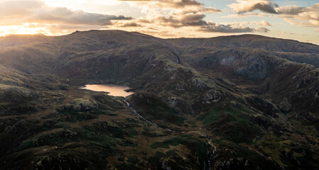 Aerial view of Easedale Tarn above Grasmere in The lake District National Park at sunset