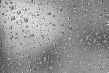 Abstract background of many drops on the window.