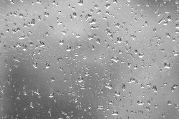 Abstract close-up photo of a wet window.