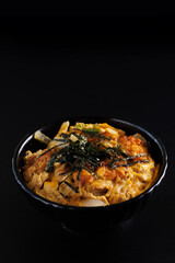 Katsudon with rice japanese food isolate in black background