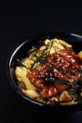 Teriyaki Pork with rice japanese food isolate in black background