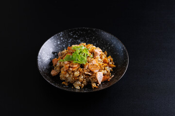 Japanese fried rice yakimeshi isolated in black background