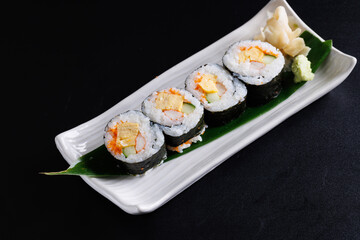 Futomaki maki rolls Japanese food isolate in black background