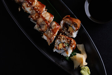 Eel Maki Maki roll made of Smoked Eel Japanese food Japanese cuisine Japanese seafood Isolate in black background