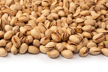 Tasty pistachios isolated on a white background.