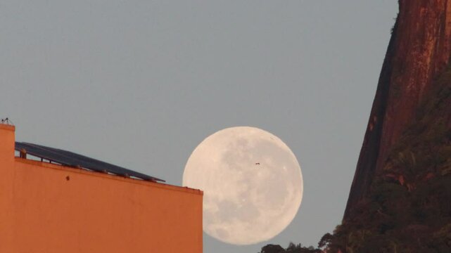 Full moon sunset view of Botafogo beach in Rio de Janeiro.