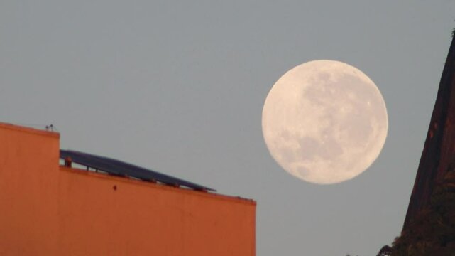 Full moon sunset view of Botafogo beach in Rio de Janeiro.