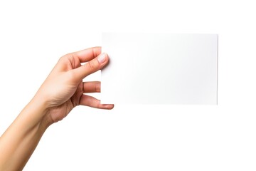 Obraz premium A person holds a piece of paper in their hand