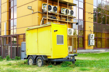 robust diesel generator, securely chained, parked beside a house brimming with air conditioners,...