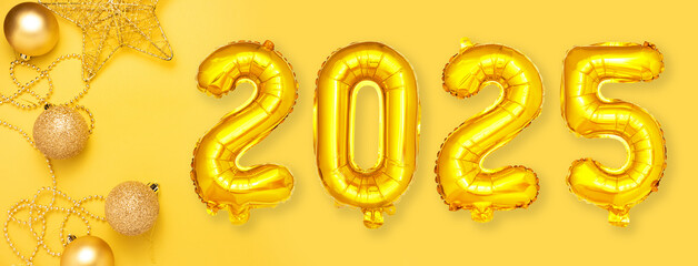 Red foil balloons with the number 2025. Happy new year and christmas holiday concept. Top view copy space.