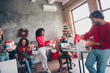 Photo of corporate friends workers congratulate xmas giftbox each other atmosphere office party indoors
