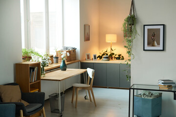 Background image of cozy home interior decorated with green plants and pictures on wall, simple apartment setting