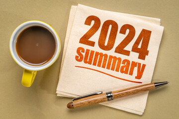 2024 year summary text on a napkin with a cup of coffee, end of year business concept