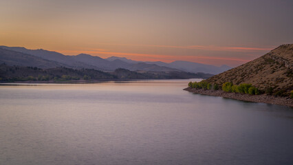 dusk over calm waters of Horstooth Reservoir at foothills of Rocky Mountains in Colorado