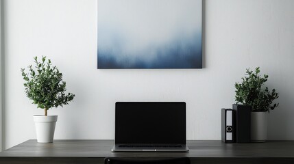 A minimalist desk setup featuring a sleek laptop, a potted plant, and soft lighting. This clean and organized workspace creates a calming atmosphere ideal for productivity and creativity