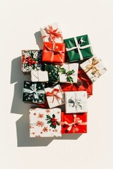 Wrapped holiday gifts in vibrant colors and patterns are artfully arranged, showcasing a festive mood perfect for celebrations