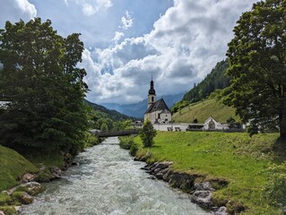 View at the Ramsau Church and the small river in Ramsau, Berchtesgaden (Bayern, Germany)