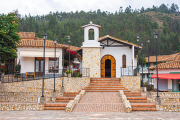 Fototapeta premium Charming Colonial Church in Little Town Boyacense, Duitama, Boyacá, Colombia - A Glimpse of Traditional Colombian Architecture Surrounded by Scenic Hills