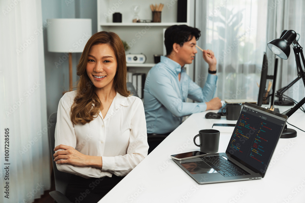 Wall mural profile smiling beautiful asian businesswoman looking camera to portrait pose at modern office on wo