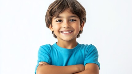 Delightful Child in a Casual Blue T-Shirt Smiling Happily with Crossed Arms, Radiating Positivity and Joy While Looking at the Camera