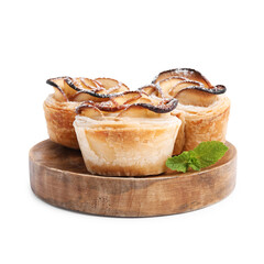 Freshly baked apple roses with mint isolated on white