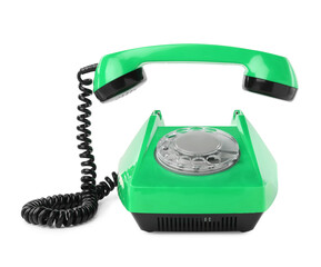 Old green telephone with rotary dial isolated on white