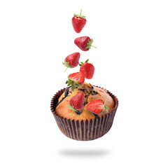 Yummy muffin and strawberries in air on white background