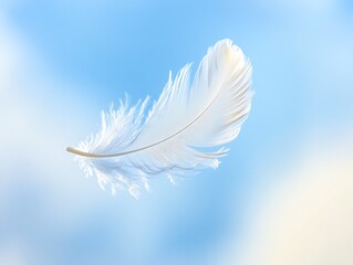 Naklejka premium Close-up of a delicate white feather floating against a soft blue sky background, symbolizing lightness and serenity.